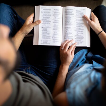 people sharing a book